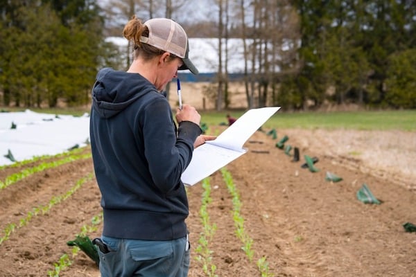 farmer with clipboard and paperwork