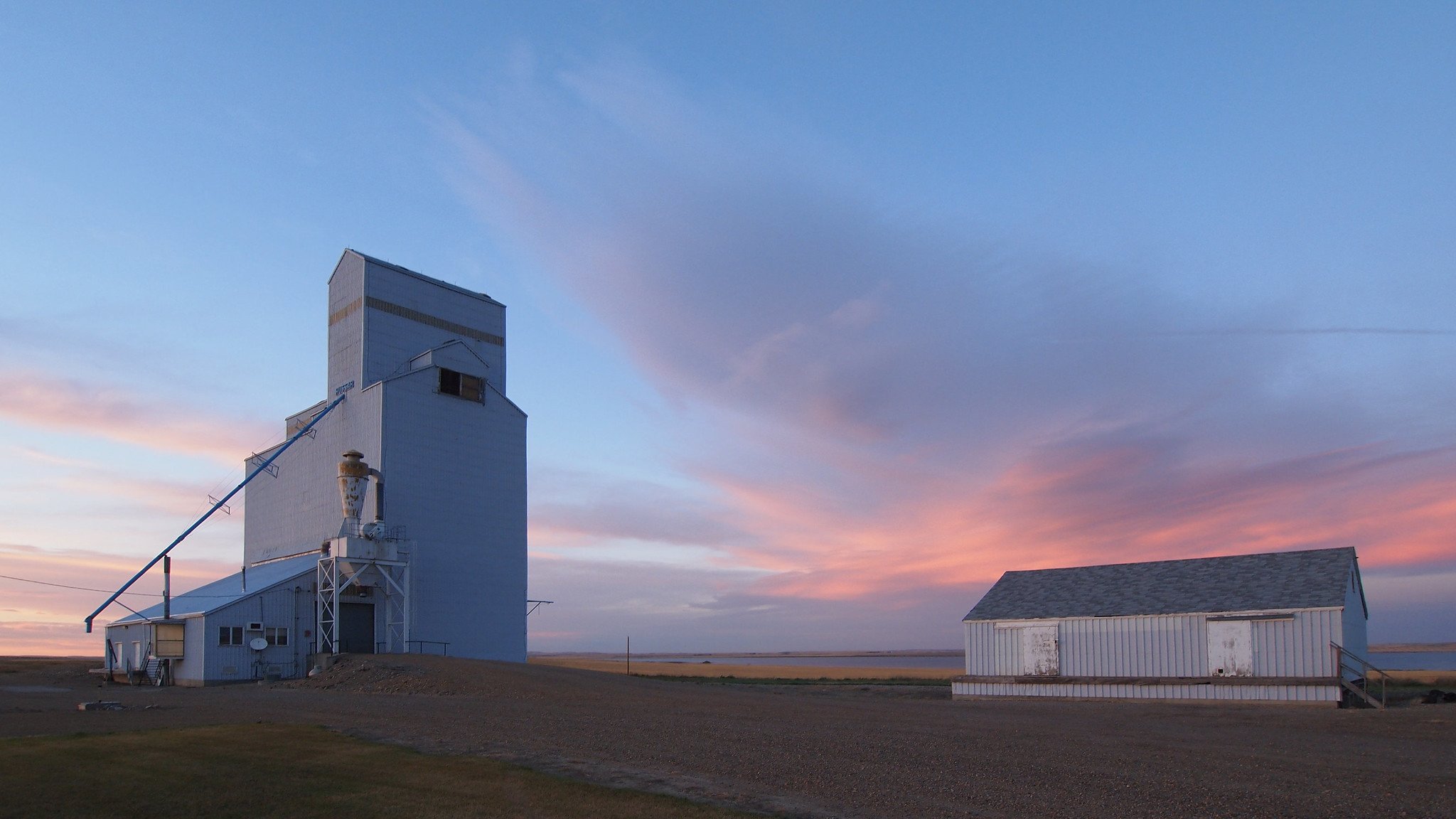 A grain elevator at sunset