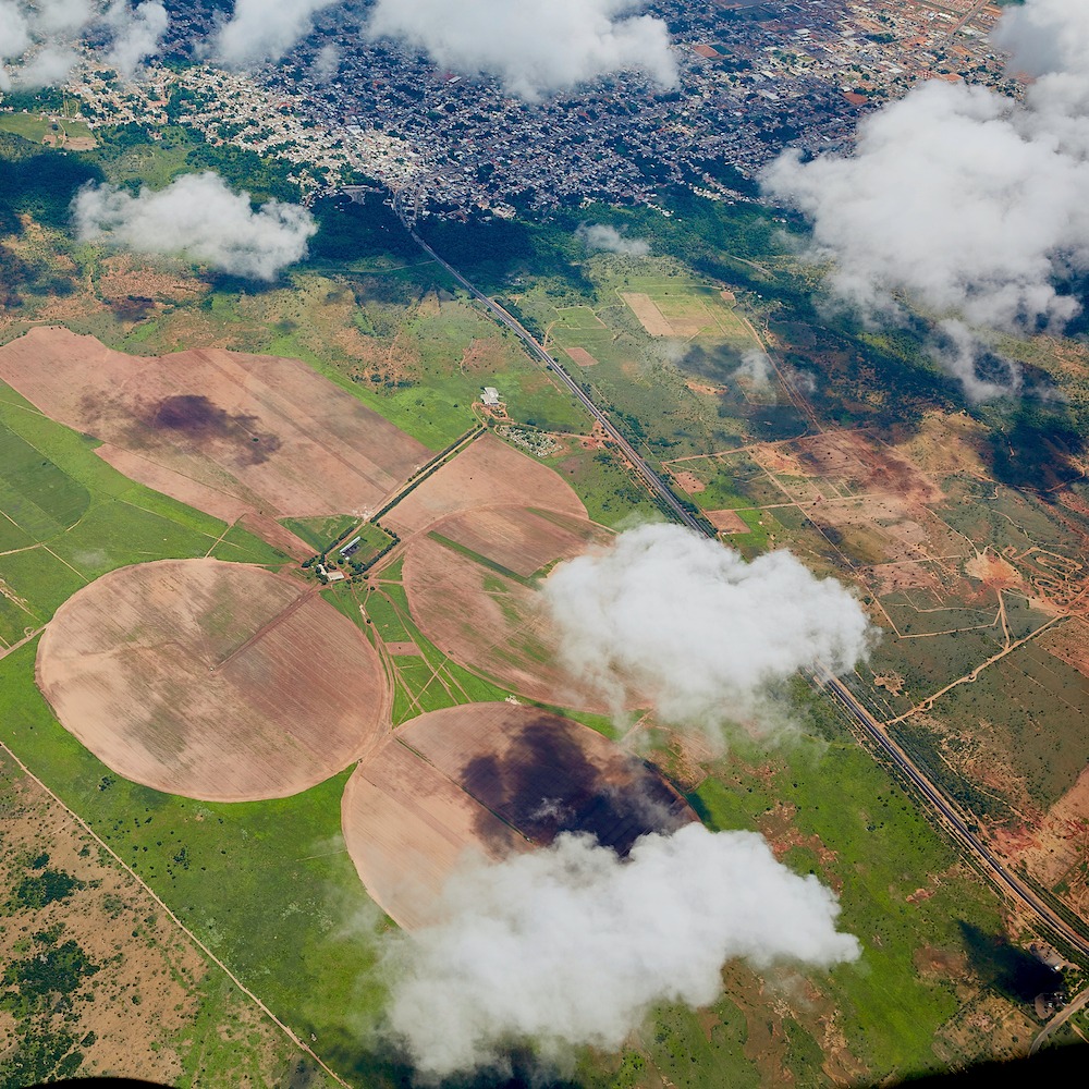 aerial pivot fields with clouds IG